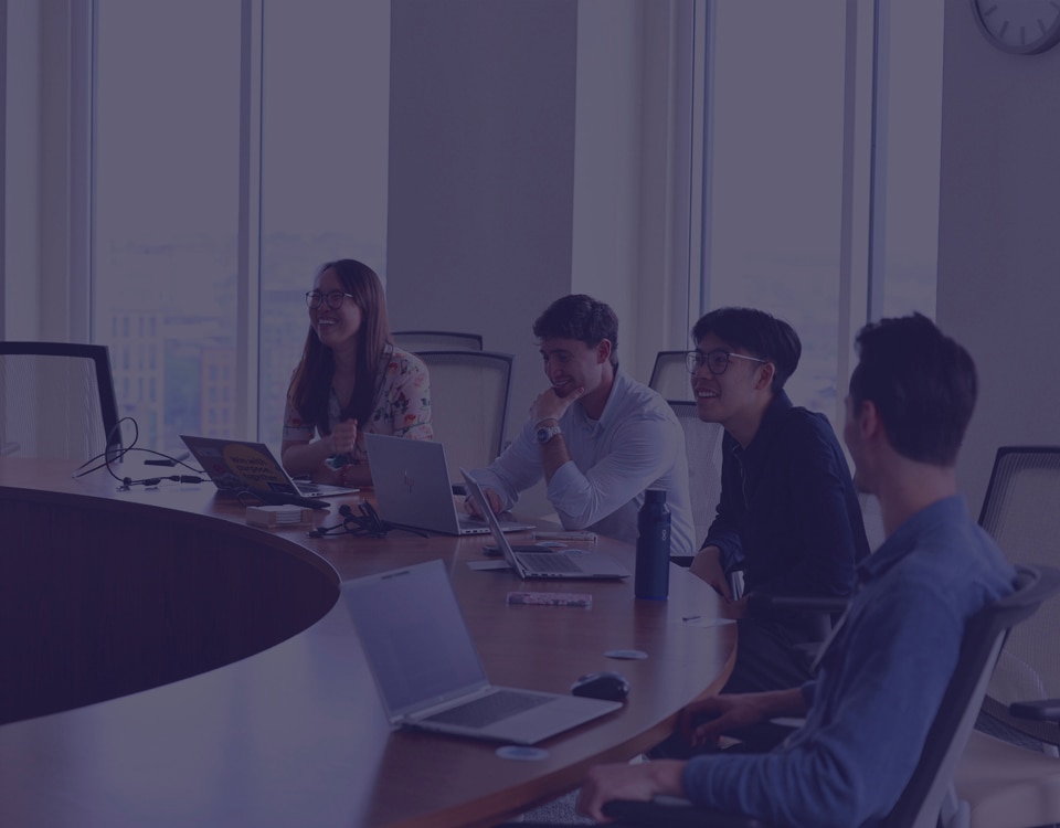 Team chatting and meeting in a conference room